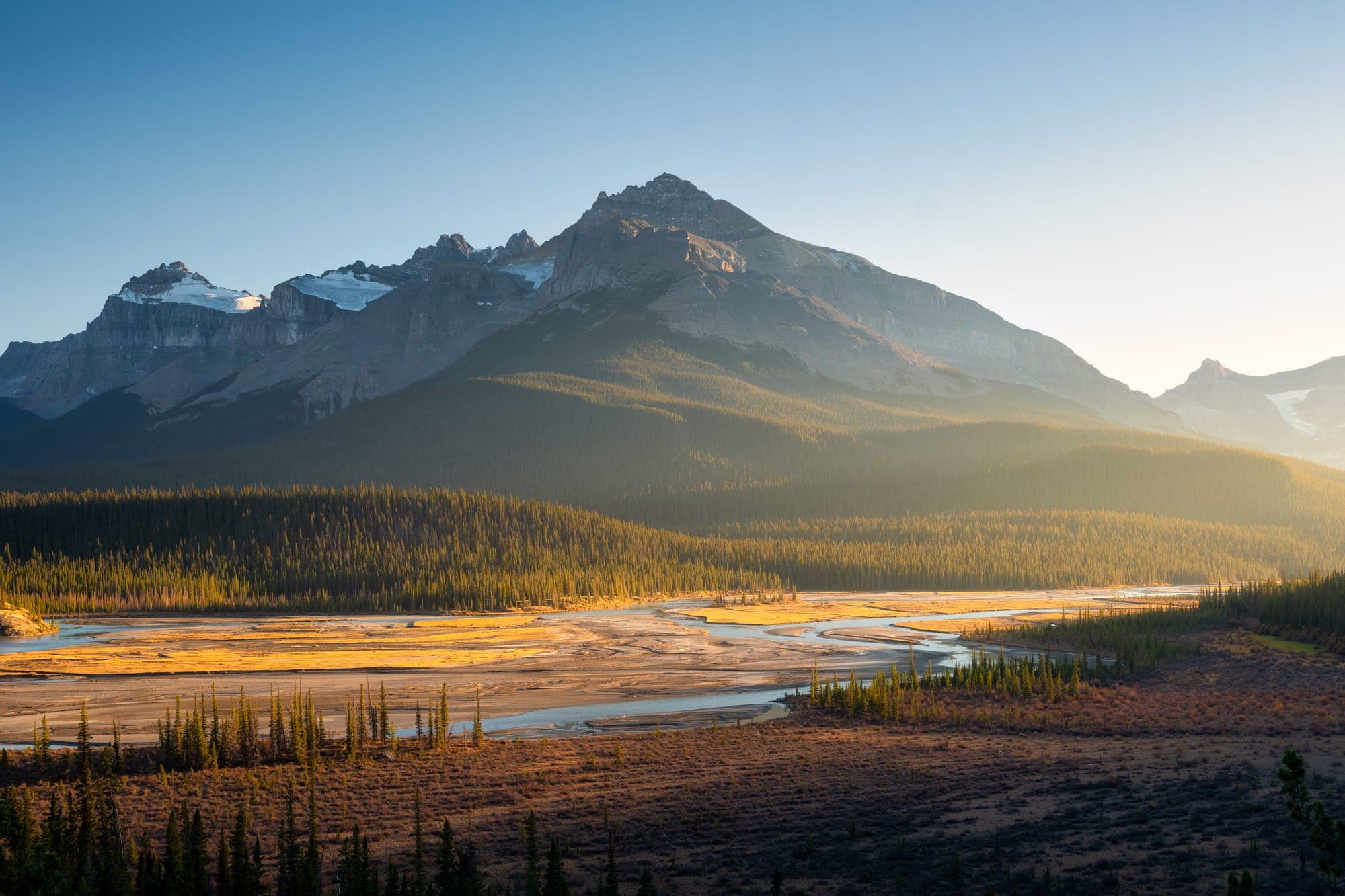 Golden morning light across a Rocky Mountain valley